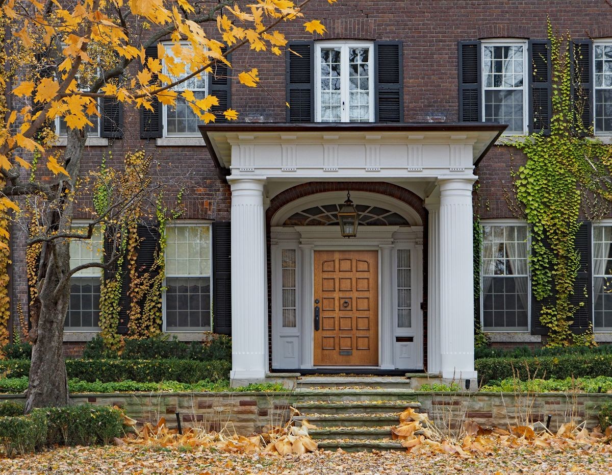 house with portico entrance and fall color
